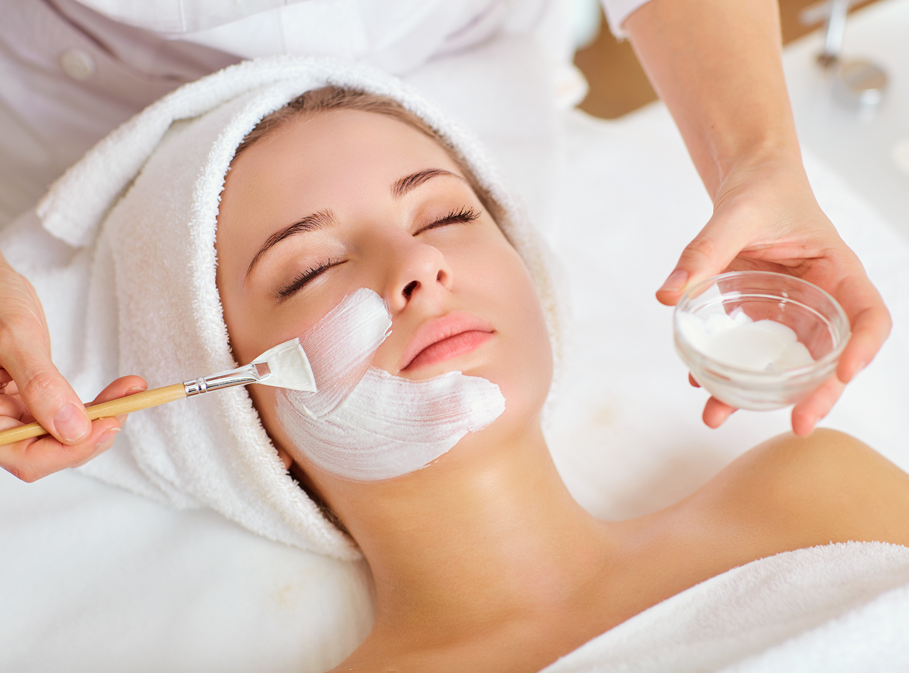Woman in mask on face in spa beauty salon CO2 Cool Peel Environ